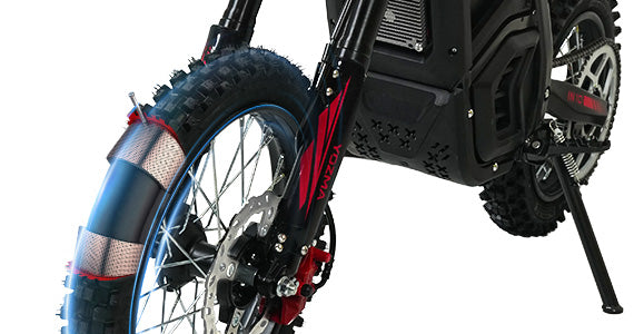 Dual-size Puncture Resistant Fat Tires: The rugged, knobby tread on a puncture-resistant fat tire dirt bike, offering excellent grip and long-lasting performance.