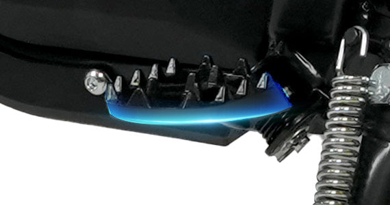 Adjustable Kickstand: A view of the sturdy, adjustable kickstand on an electric motocross bike, showing the durable cast-steel foot pegs for stable support.
